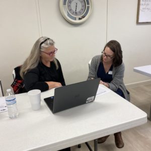 CWJC volunteer helping with computers